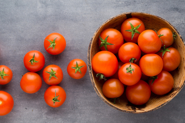 Tomato on the gray background. - Photo, Image