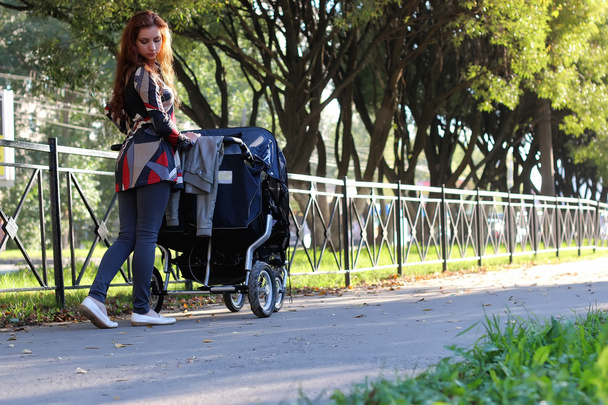 women walk stroller summer - Foto, Imagem