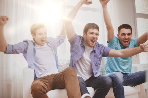 happy male friends at home - Фото, зображення