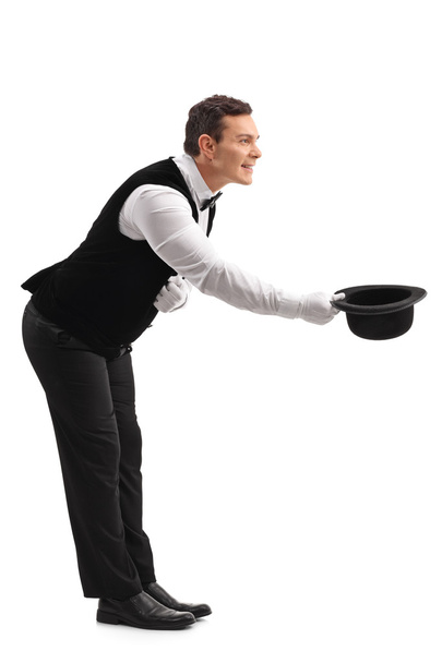 Waiter bow down and taking off his hat  - Photo, Image
