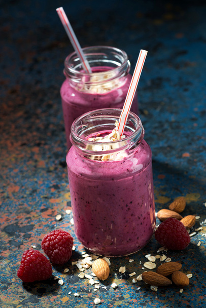 healthy berry smoothies with oatmeal in bottles  - Foto, Imagem