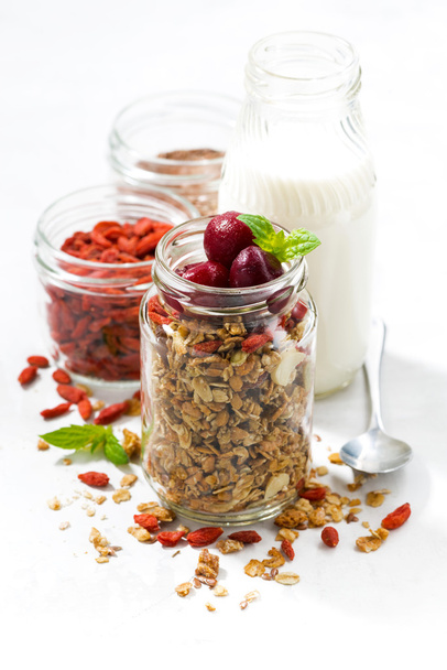 healthy food, granola with goji berries and cherries in a glass  - 写真・画像