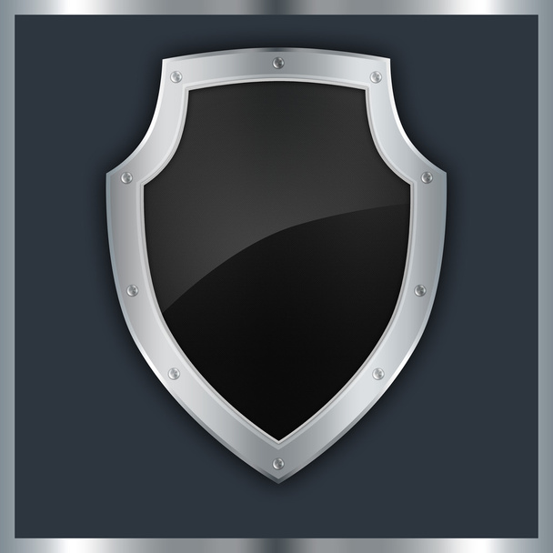 Abstract metallic shield on a black background. - Foto, Bild