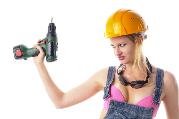 Sexy craftswoman in overalls - Photo, Image