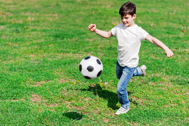 Cute male child is playing football - Zdjęcie, obraz