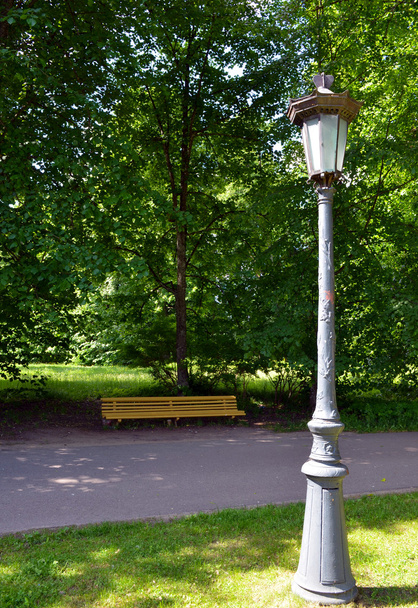Vintage retro park lamp pole and wooden bench - Photo, Image