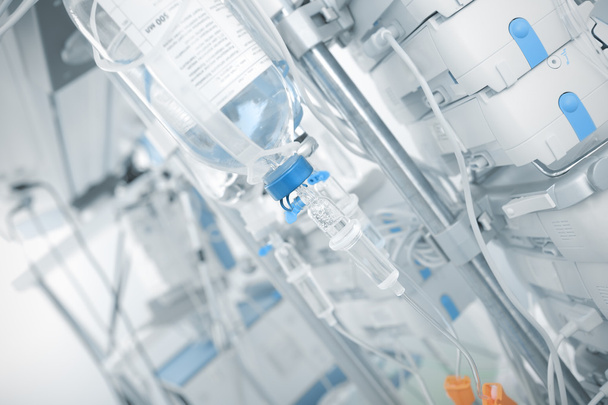 Iv drip in ward on the background of modern equipment - Foto, Imagen