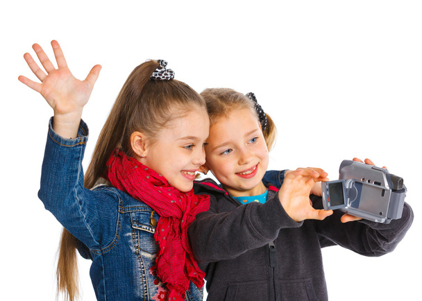 Two young girls with a camera - Foto, Imagen