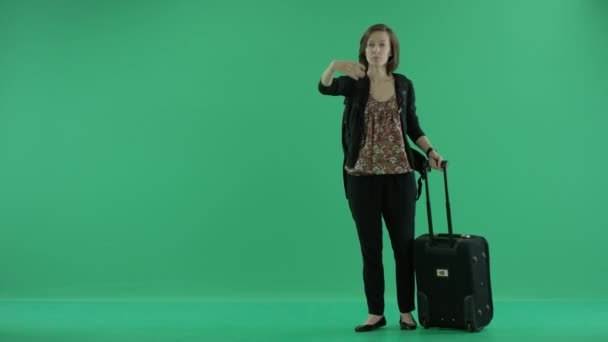 woman with suitcase beckoning inviting to come here - Materiał filmowy, wideo