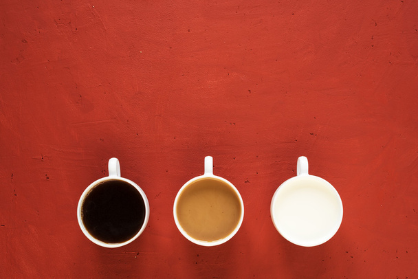 Three cups with milk and coffee - Photo, image