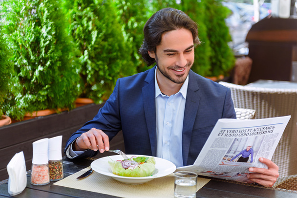 Happy man dining in cafe - 写真・画像