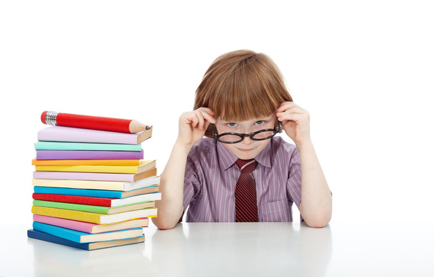 Little boy with glasses and lots of books - Фото, изображение