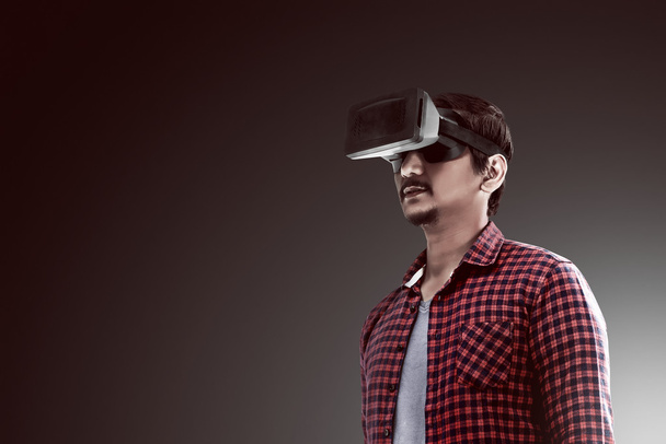 Young asian man wearing VR headset - Fotoğraf, Görsel