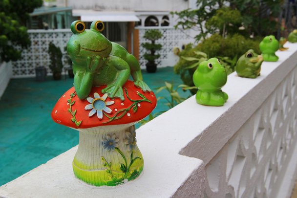 a frong doll decorated in the garden - Photo, Image