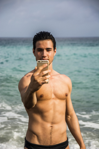Shirtless Young Man Taking Selfie Photos at Beach - Photo, Image