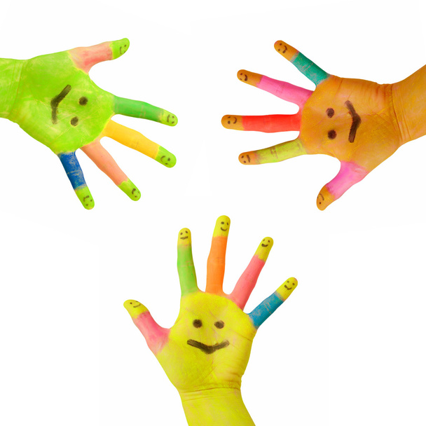 Trois mains colorées avec sourire peint sur la paume
 - Photo, image