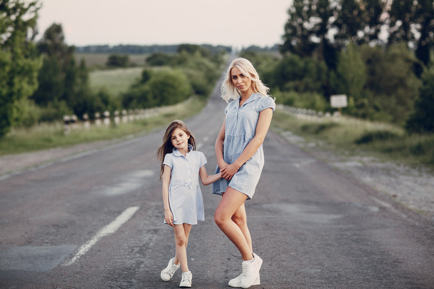 mom and daughter outside - Фото, изображение