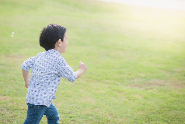 Cute Asian chid running  - Photo, Image