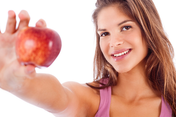 Happy girl showing red apple - Фото, изображение