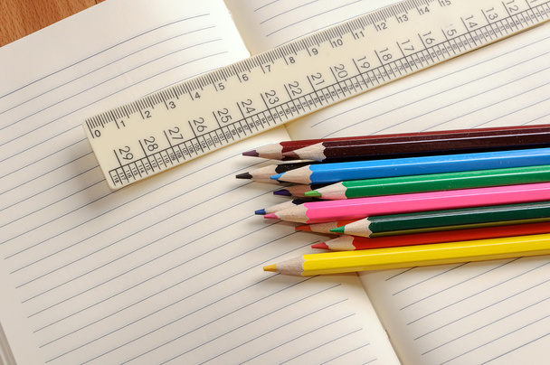 Crayons, a ruler and Notepad closeup - Photo, Image