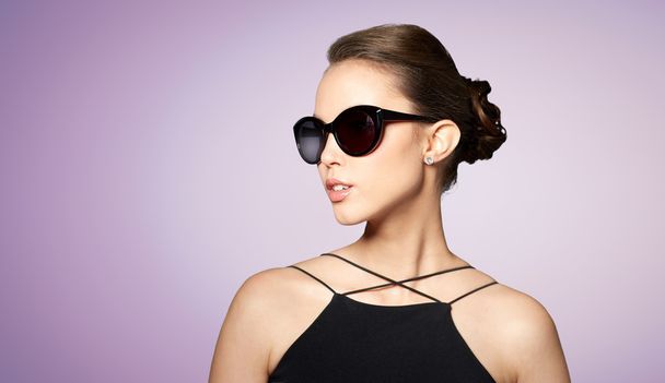 beautiful young woman in elegant black sunglasses - Zdjęcie, obraz