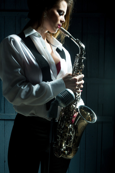 retro woman with saxophone - Фото, изображение