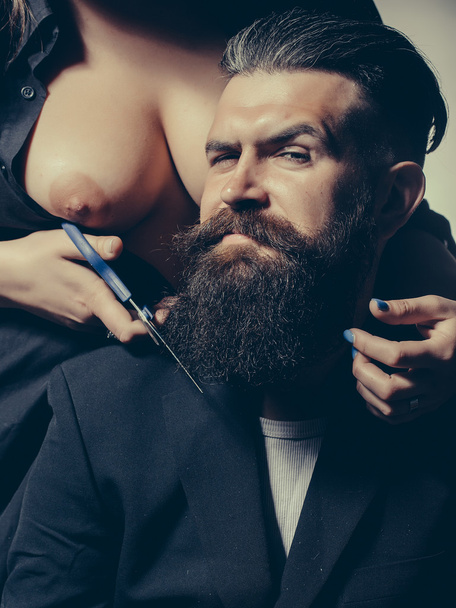 bare woman cutting male beard - Valokuva, kuva