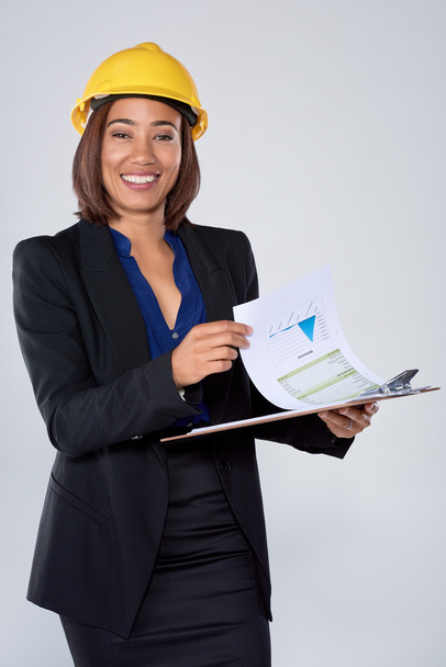 Woman engineer architect holding clipboard - Фото, изображение