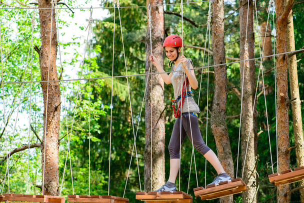 adventure climbing high wire park - Young woman on course in mou - Photo, Image