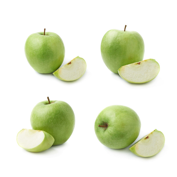 Green apple next to a slice isolated - Photo, image