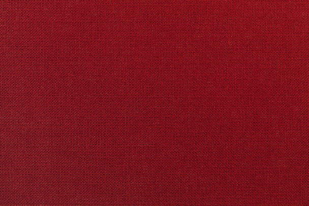 Tmavě červené pozadí z textilního materiálu. Tkanina s přirozenou texturou. Pozadí. - Fotografie, Obrázek