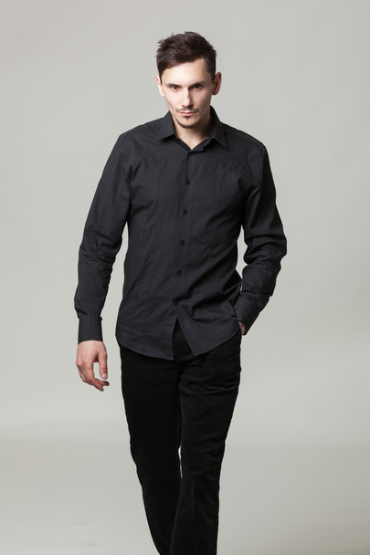 Studio portrait of handsome elegant young man in black  clothes  - Fotoğraf, Görsel