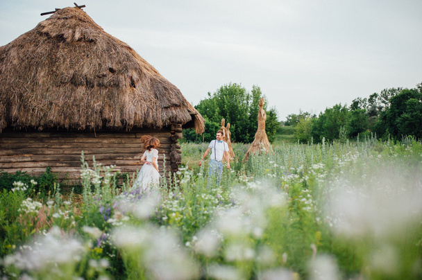 Happy Bride and groom walking on the green grass - Valokuva, kuva