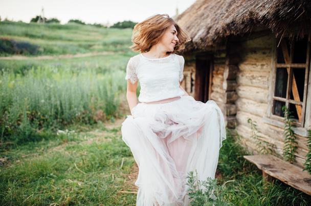 beautiful girl in white dress lies in green grass - Valokuva, kuva
