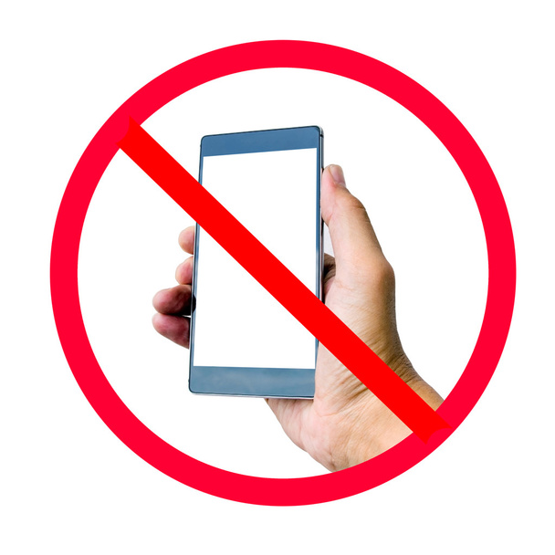 Hand holding smart phone with do not use smart phone sign. - Foto, imagen