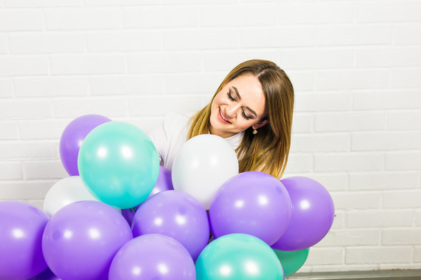 Young pretty woman with colored balloons - Foto, Imagen