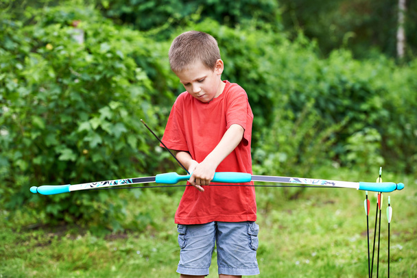 Little archer with bow and arrows - Фото, зображення