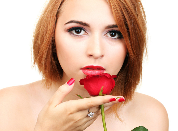 Portrait of sexy young woman with red rose - 写真・画像