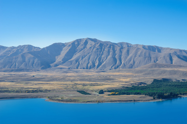 Gyönyörű Lake Tekapo kilátás a csúcs a Mount John, Új-Zéland. - Fotó, kép