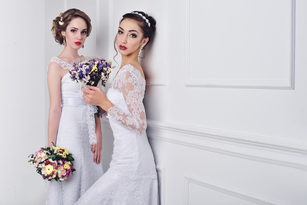 Two beautiful bride posing together - Fotoğraf, Görsel