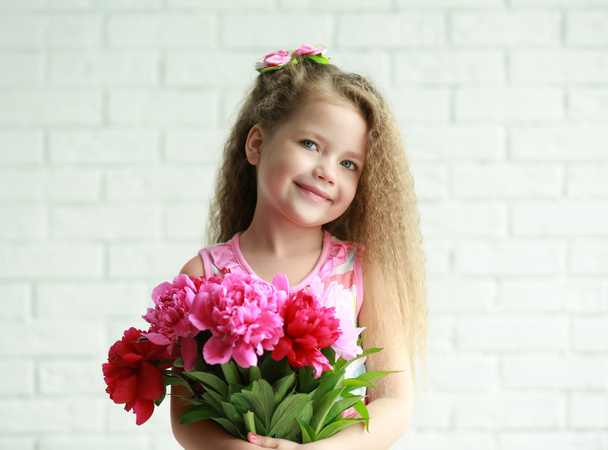 Beautiful girl holding  peonies bouquet - 写真・画像