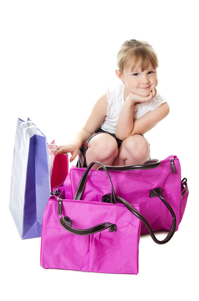 The little girl with a lilac bag isolated - Фото, изображение