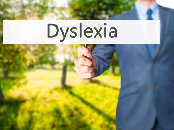 Dyslexie - Homme d'affaires main tenant signe
 - Photo, image