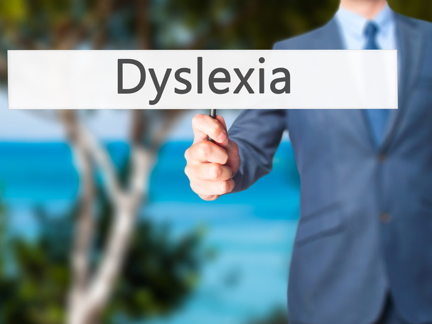 Dyslexie - podnikatel ruka drží znak - Fotografie, Obrázek