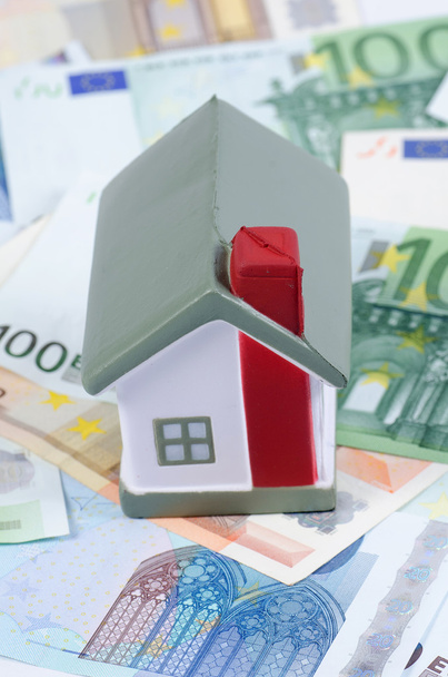 Toy house for euro banknotes as a background - Фото, зображення