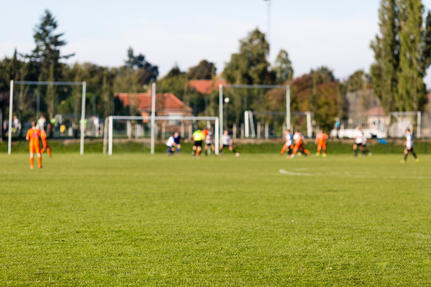 Blurred soccer players playing amateur soccer match - Fotografie, Obrázek