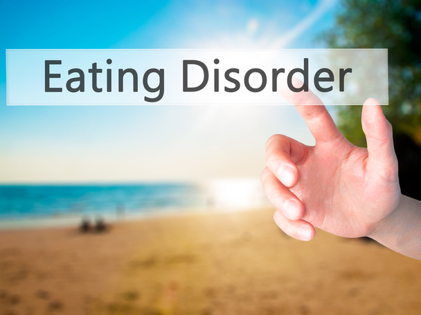 Eating Disorder - Hand pressing a button on blurred background c - Photo, Image