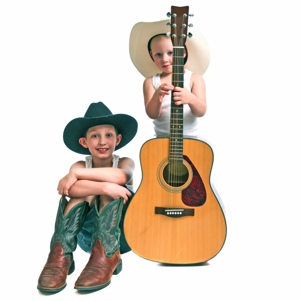 Due piccoli cowboy con una chitarra
 - Foto, immagini