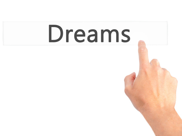 Träume - Hand auf Knopfdruck auf verschwommenes Hintergrundkonzept - Foto, Bild