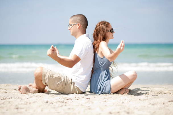 Meditating at the beach - Photo, image